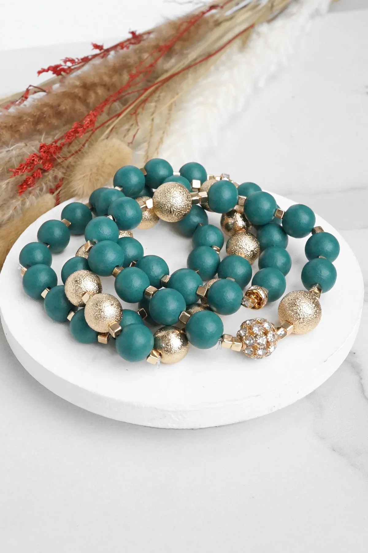 Beaded bracelets set in Forest Emerald Green and Gold with clear crystals