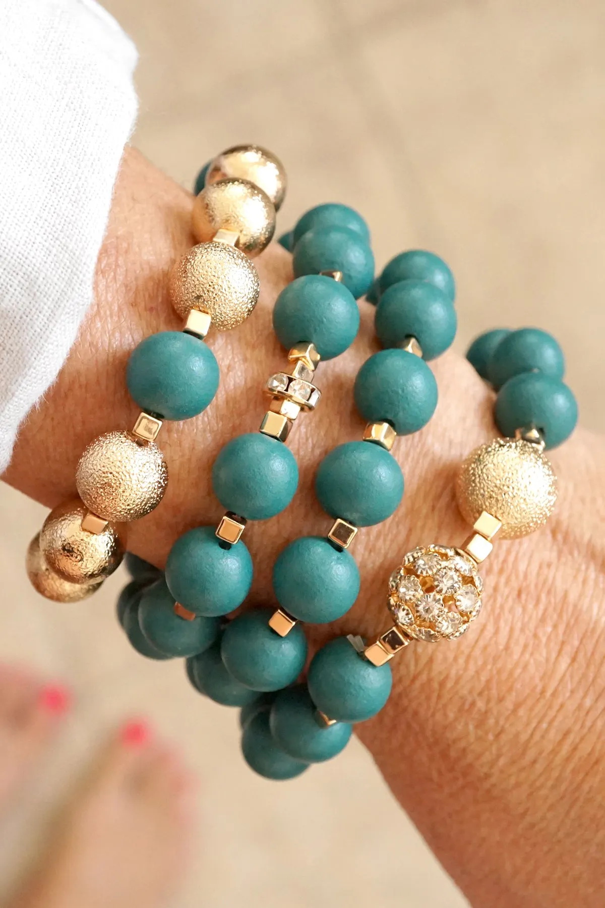 Beaded bracelets set in Forest Emerald Green and Gold with clear crystals